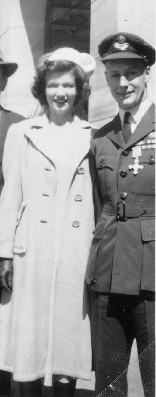 A black-and-white archival portrait of a young couple, the man in Allied service uniform.