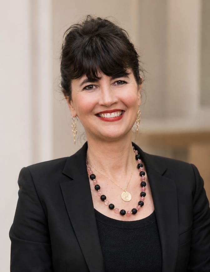Emily de Wolfe Pettit, photographed outdoors in a dark jacket.